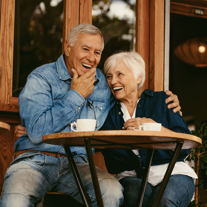 an older couple enjoying coffee together